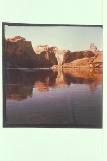 Mouth of side canyon at Mile 73.6, left bank, Glen Canyon. View down river