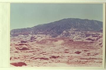 Across to Black Brush Mesa and Surprise Valley. Navajo Mountain at top