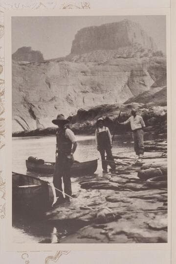 Camp of the Rust-Fraser party at the mouth of Aztec Creek. Left to right: Sarah Fraser, Bert Loper and George C. Fraser