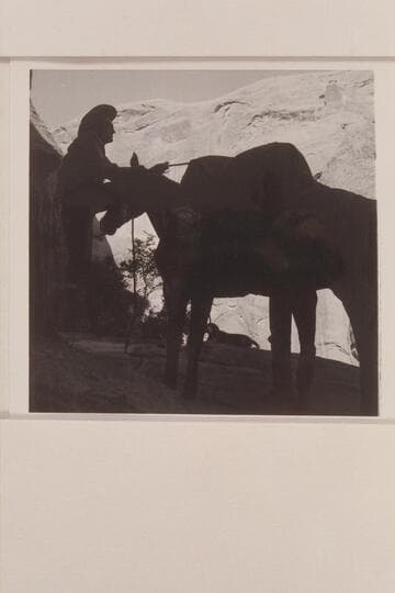 Tom Daly throws on the packs at camp at mouth of Bridge Canyon