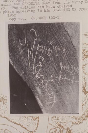 Powell Expedition inscription on rocks near the fort at the mouth of White Canyon left by the party under Dellenbaugh when bringing the "Canonita" down from the Dirty Devil to Lees Ferry