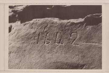 Inscription cut in rock at right bank in Glen Canyon opposite Lake Creek at Mile 113. It is generally thought to be a fake