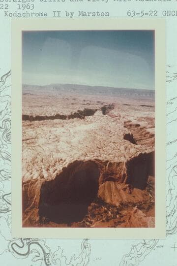 Down Cow Canyon to the Escalante River. The Straight Cliffs and Fifty Mile Mountain in the distance