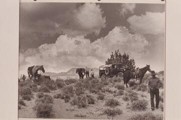 Changing from truck to pack string.  Rainbow Plateau at edge of Navajo Canyon.  Nancy & Tom Daly work at the packs.  Whitehat at right