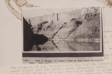 Base of Wingate at water's edge at bend below Waterpocket Fold.  Note middle member and top member with arches