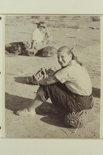 Zoe Desloge at Pierces Ferry, end of 1947 Grand Canyon traverse.  Marie Saalfrank sits in the background