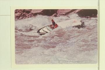 Jim Bechtel drives Triangle through Hance on the right. Komie is passenger