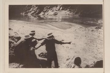 Some obvious posing to demonstrate the checking of a rapid; Nevills party of 1938