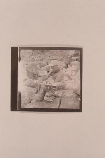 Marston pounding home the sign at Browns Riffle; Mile 12 in Marble Canyon where Frank Mason Brown was drowned 1889, July 10