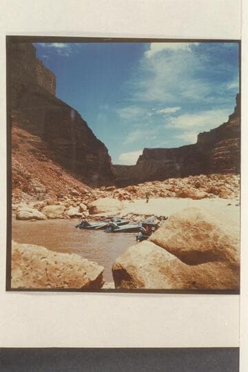 Boats at beach below 24.5 Mile Rapid.  Willie walks down the beach