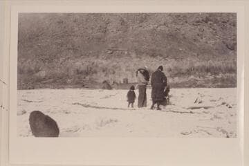 Sid Wilson on the ice at Lees Ferry. Sid's daughter stands behind him. Note the boiler of the steamer "Charles H. Spencer." Photo is middle of print copied by negative 25-1 LSFY 39