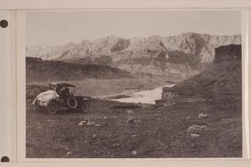 Automobile on road to Lees Ferry. Hopkins driving down the dugway