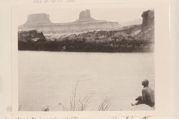 Buttes of the Cross. Crescent Castle; across Townsite Bottom from Mile 29.7. John Harvey Jacobs sits on the shore