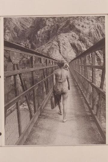 Margaret Marston crosses suspension bridge to right bank. Bright Angel Creek