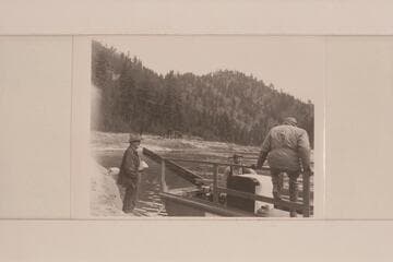 Don Smith in his 30-ft. sweep scow on the Salmon River. Near Shoup. Note the refrigerator
