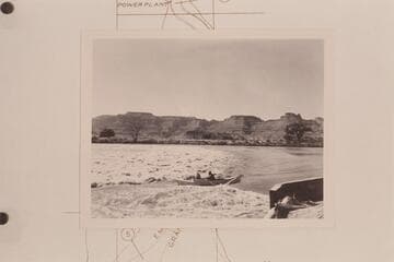 Moulty Fulmer drives the "Moja" through the race at the left side of the dam above Green River. Maradel Marston rides with him