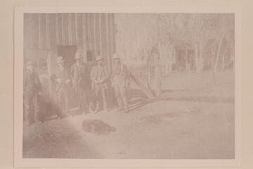 The old saloon at Thompson: H. G. Ballard at center and Doc King on right. The scene of many a fight