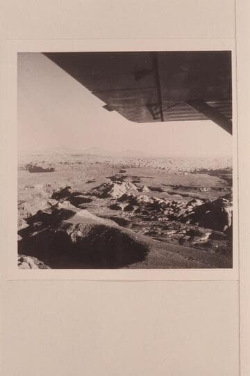Down Cha Canyon from the air above the trail north of Navajo Mountain.  Cha Canyon flows into the San Juan River at Mile 11.5.  The Henry Mountains on the skyline- Waterpocket Fold is this side of the Henry's