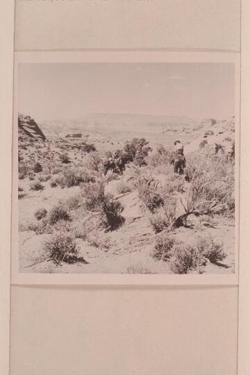 Mary Abbott on the trail to Rainbow Bridge. Fifty Mile Mountain in distance, Cha Butte at right and Cha Canyon in middle distance