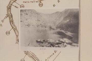 The four skiffs of the Galloway-Stone fleet beached at the head of Triplett Rapid before Galloway ran them through the rapid while the other members of the crew portaged the dunnage