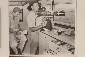 Alfred and Elma Milotte photographing large and often dangerous wild animals on the African velt from camera port in the steel-sheathed truck especially built for this Walt Disney's "True Life Adventure" safari