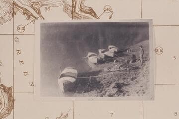 Boats moored at camp at mouth of Henrys Fork