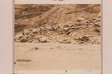 Rapid at mouth of 22 Mile Wash. A boatman is visible at center