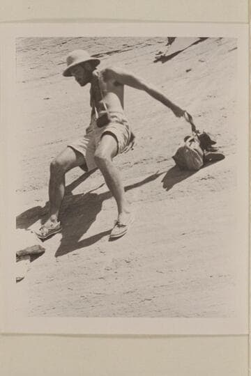 Barry Goldwater sliding down the slic-rock