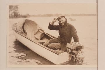 Lewis R. Freeman posing with an Elto motor. Ohio River