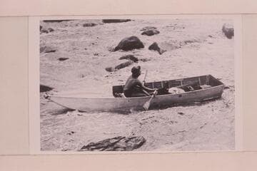 Lorin Bell in a 15 foot Fold-Flat boat; Government Rapid. The relationship to the Nevills' "Sadiron" design is obvious