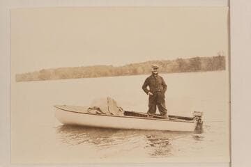 Lewis R. Freeman on the Ohio River with small boat and Elto motor