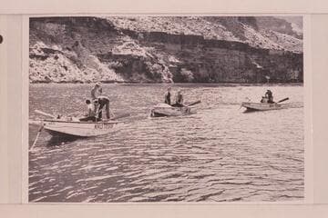 The Nevills' boats at the end of his first Grand Canyon traverse; Lake Mead. In the "WEN"- Clover, Nevills and Kolb; in the "Mexican Hat"- Jotter and Bell; and in the "Botany"- Reed and Gibson