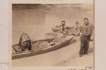 Frazier and the three remaining skiffs of The Dusty Dozen below Vulcan Rapid.After portaging the skiffs at Vulcan Rapid, Frazier dropped overboard in the riffle at Mile 179.7 and the party beached. This photo is probably at Mile 180