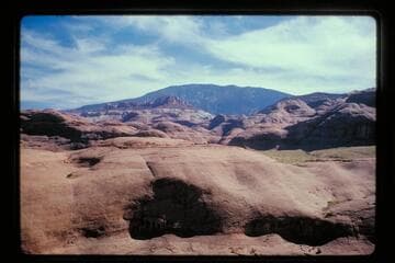 toward Navajo Mountain from edge of canyon of 71.3 on flat near mouth