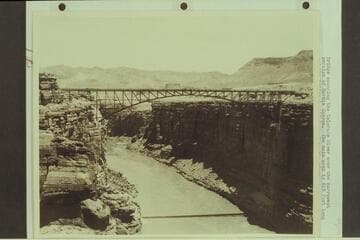 Bridge spanning the Colorado River over the narrowest portion of Marble Canyon.  The main arch is 616 ft. long and the bridge is 468 ft. above the river.  From Freeman collection