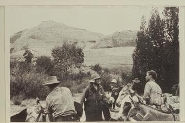 Surprise Valley. Slope of Navajo Mountain at right. A group of the Ansel Hall (?) crowd whom we found at camp site when we arrived