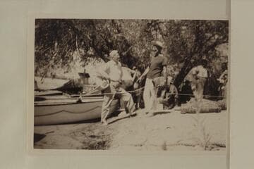 Joe Desloge discusses the prospects with Marston prior to start of 1950 motor run of Grand Canyon. Lees Ferry