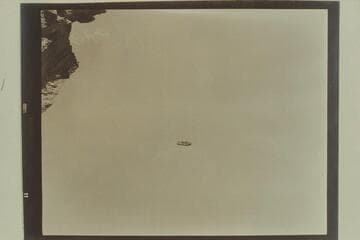 Above Badger Creek Rapid.  Georgie White at the oars and Elgin Pierce in the 10-man neoprene inflated boat in which they traversed the Marble and Grand Canyons in July 1952