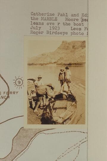 Catherine Pahl and Edith Kolb on the stern of the "Marble." Moore seated at left and Burchard leans over the boat. Lees Ferry