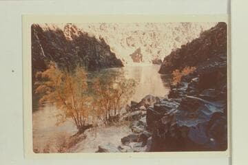 Upriver from end of old trail to head of Horn Creek Rapid from left bank