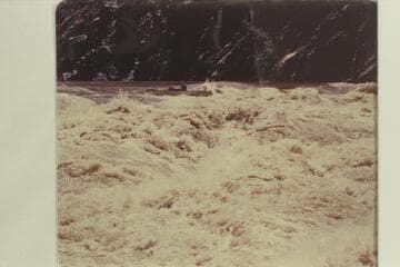 John Harper in the sadiron "Mexican Hat III." Top of Horn Creek Rapid. Bright Angel gauge: 8,750 cfs