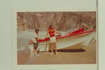Ed I'Anson congratulates Garth Marston on the ride in Monument Creek Rapid. Bill Austin had tried an up run and got fouled in a hole and then pounded a rock before running high and dry onto the beach