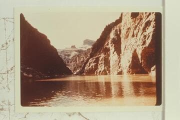 Upriver from near mouth of Sapphire Canyon.  The small butte at left is Scylla Butte and Geike Peak towers above it.  From near the stop for lunch