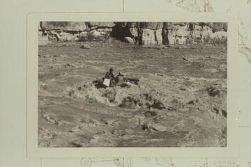 The craft swings clear of the hole and turns its bow downriver without aid of motor. Chas Peterson is in the dark hat at left. Dock Marston at right and the motor-man is wearing the white preserver. Coal Creek Rapid