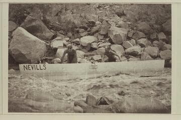 Nevills and Bell work the 16 ft. punt down the shore; San Juan River. 13-Foot Rapid- lining or nosing