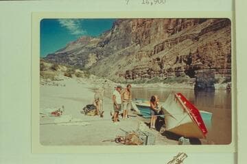 Repairing the "Wee Red" at the Vulcans Anvil. Jon Hamilton bends over at left. Ed l'Anson and Jim Bechtel watch Buzz Belknap at the polishing