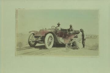The Zahn's [sic] Franklin car on the plank road near Yuma.  They had taken the car from Los Angeles to the Zahn Mine on the San Juan River and toured the western Navajo Reservation and were returning to Los Angeles when this picture was taken
