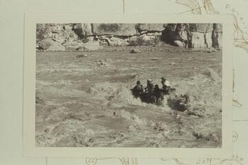 George Stewart's 10-man in Coal Creek Rapid in hole to right of course and with drowned motor. The craft swung its nose to the left after hitting a rock in the hole as reported by Stewart