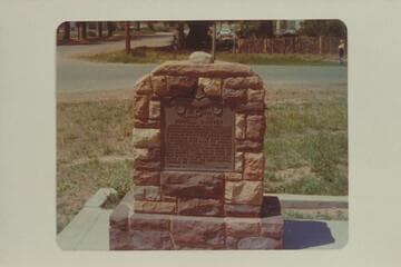 Monument in Kanab marking the north end of the Powell Baseline. The stone on top was originally in the middle of the street