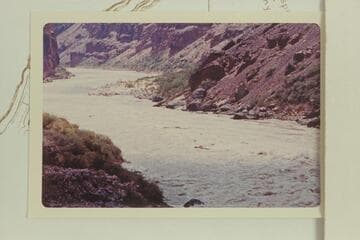 As Jim Jordan swings the "Circle" into the eddy at the foot of Vulcan Rapid an examination of the window of Dock Marston's 35mm camera disclosed two drops of water had hit it